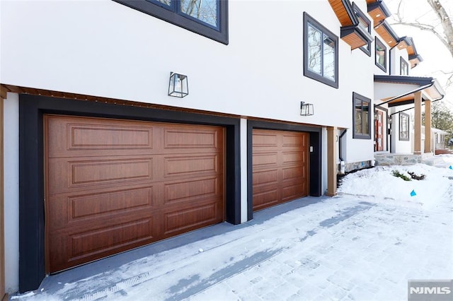 view of snow covered garage