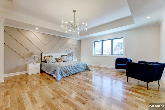 bedroom featuring an inviting chandelier, crown molding, and light wood-type flooring