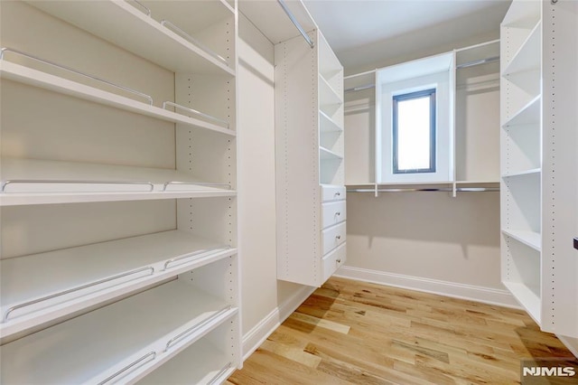 walk in closet featuring hardwood / wood-style floors