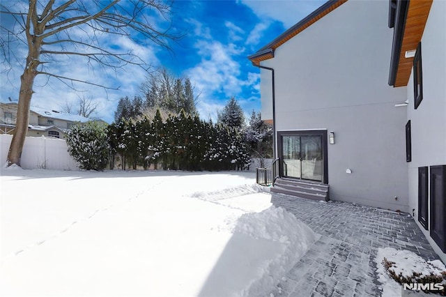 view of yard layered in snow