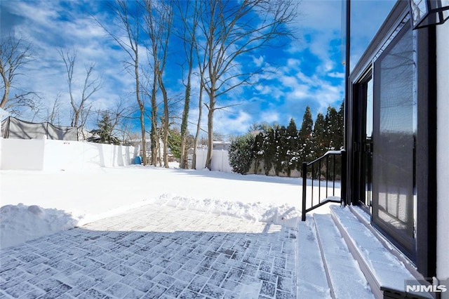 view of yard layered in snow