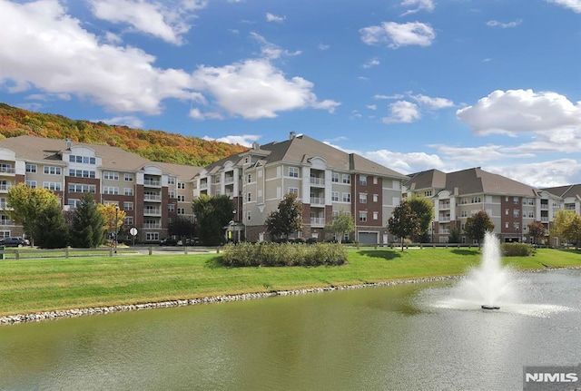 view of property with a water view