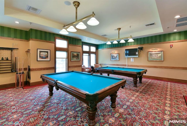 game room featuring billiards and a raised ceiling