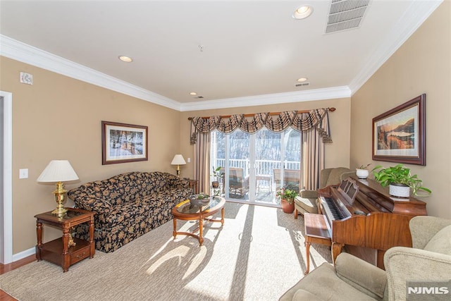 living room featuring hardwood / wood-style flooring and crown molding