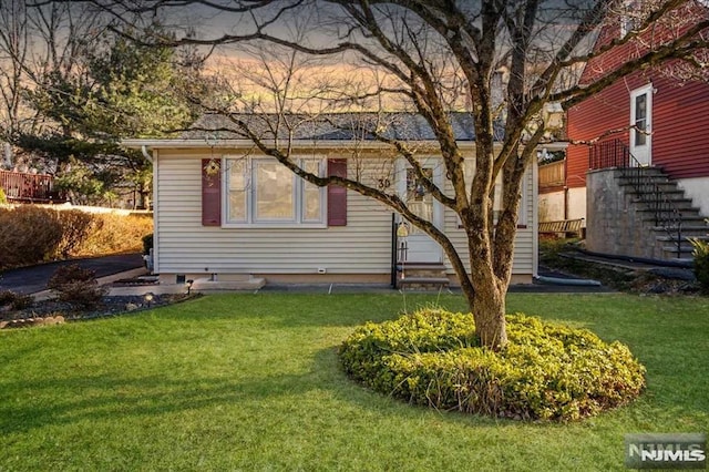 view of home's exterior featuring a yard