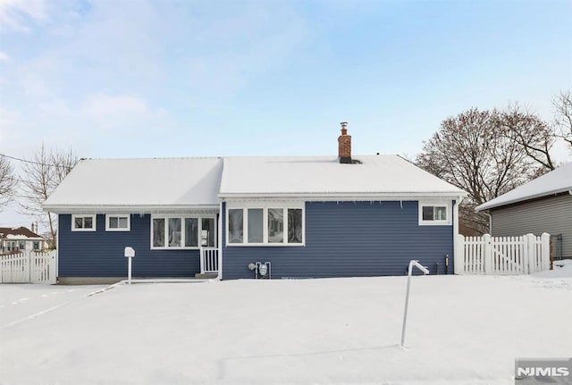 view of snow covered house