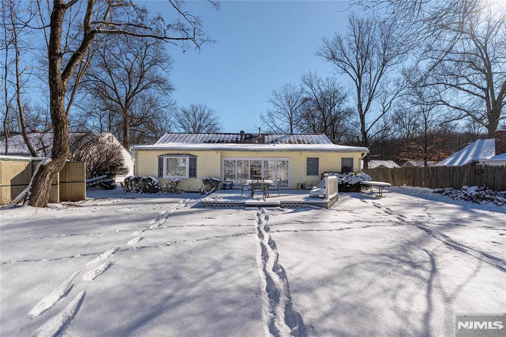 view of snow covered house