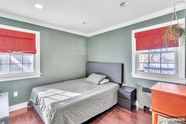 bedroom featuring radiator and ornamental molding