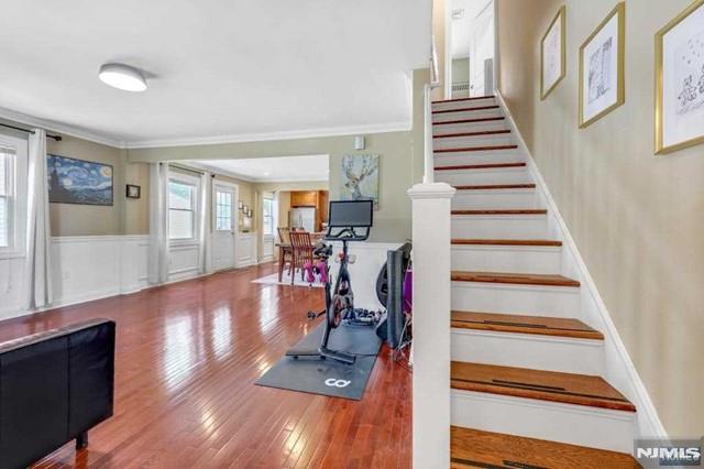 interior space featuring crown molding and hardwood / wood-style floors