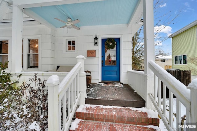 doorway to property with ceiling fan