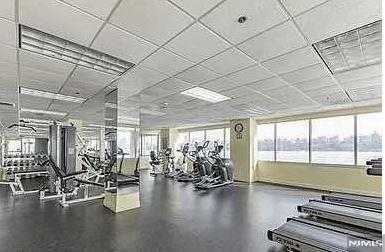 exercise room featuring a paneled ceiling