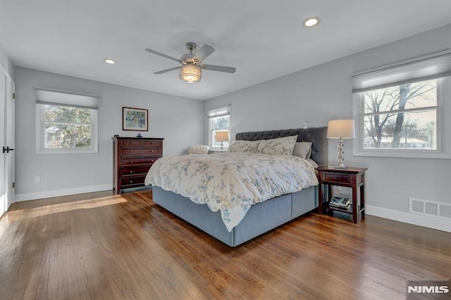 bedroom featuring dark hardwood / wood-style floors and ceiling fan