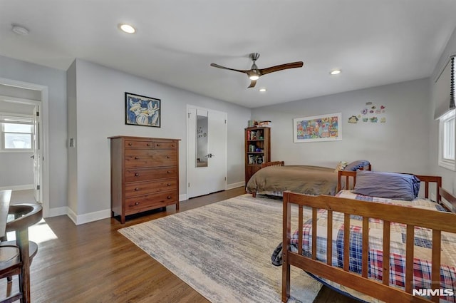 bedroom featuring ceiling fan and dark hardwood / wood-style flooring