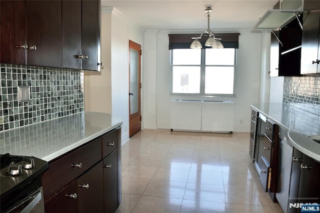 kitchen with pendant lighting, black range oven, tasteful backsplash, light tile patterned floors, and dark brown cabinets