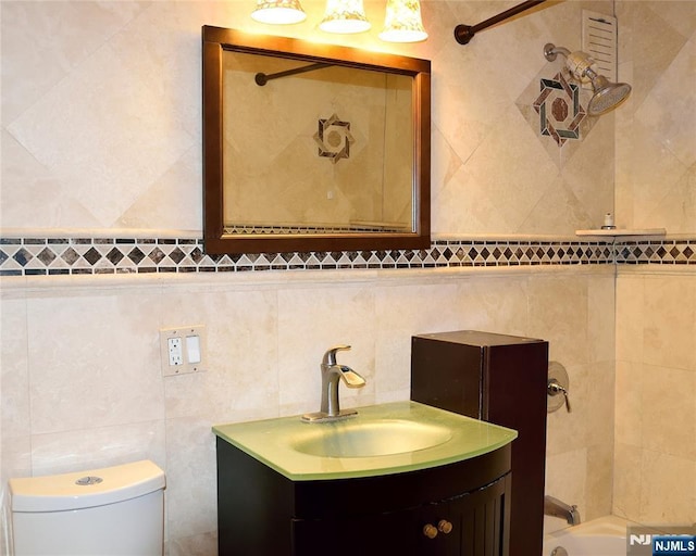 full bathroom with tasteful backsplash, vanity, toilet, and tiled shower / bath combo