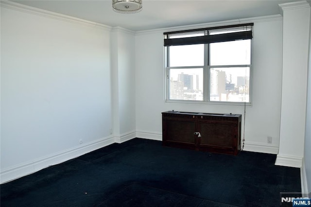 unfurnished room with crown molding