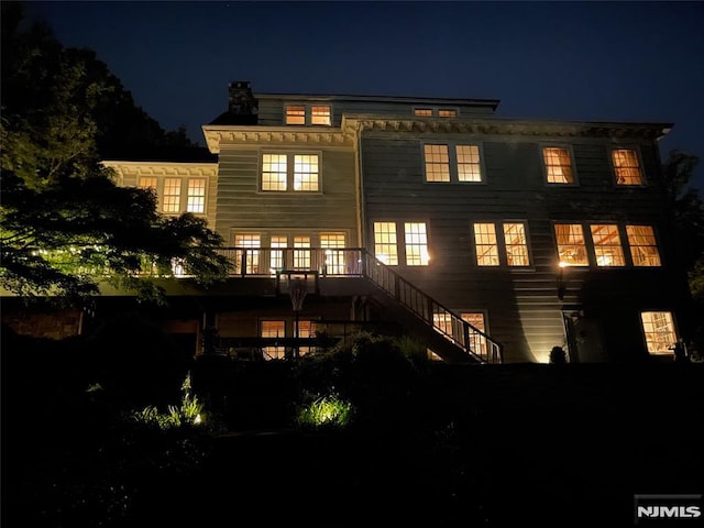 view of back house at night