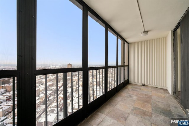 unfurnished sunroom with plenty of natural light