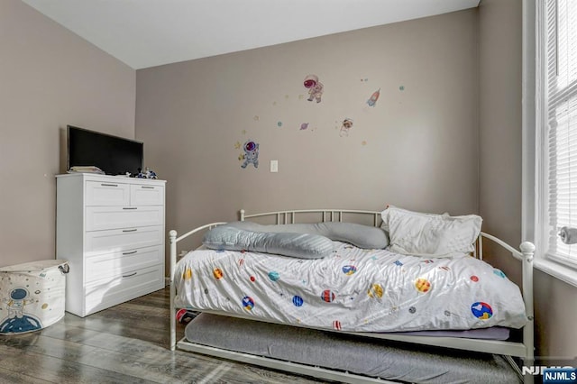 bedroom featuring dark hardwood / wood-style flooring