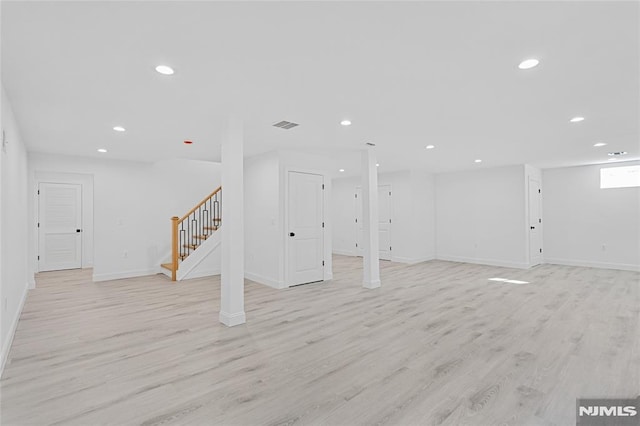 basement featuring light hardwood / wood-style flooring