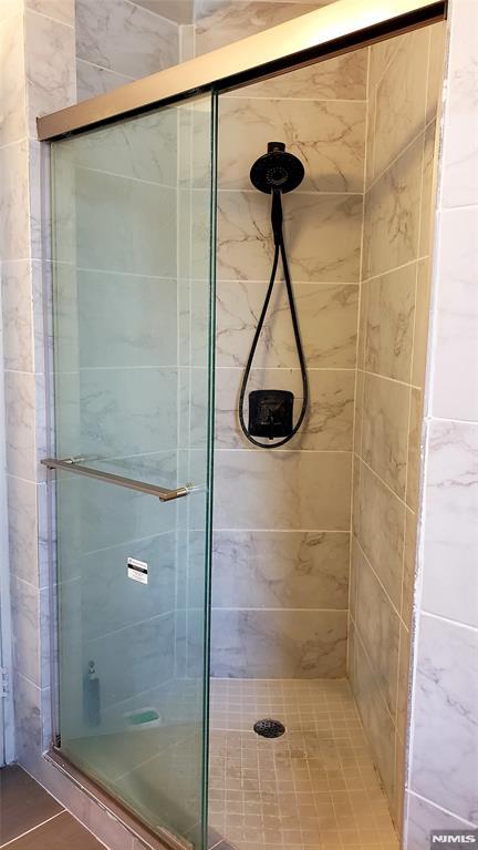 bathroom with an enclosed shower