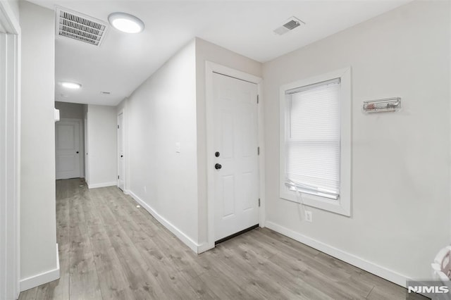 hallway featuring light wood-type flooring