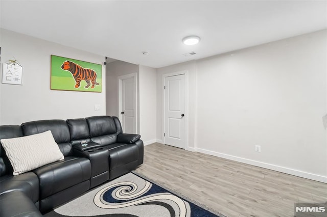 living room with light hardwood / wood-style floors