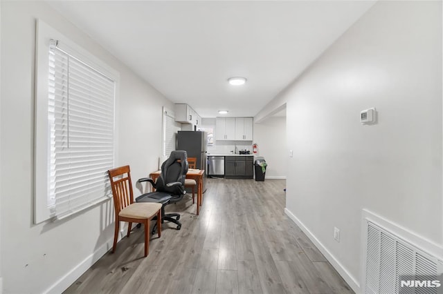 living area featuring light hardwood / wood-style floors