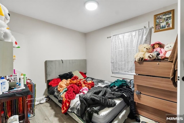 bedroom with light hardwood / wood-style floors