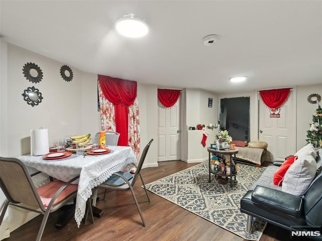 dining area with hardwood / wood-style floors