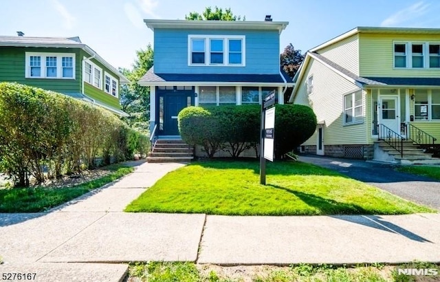 front facade with a front yard