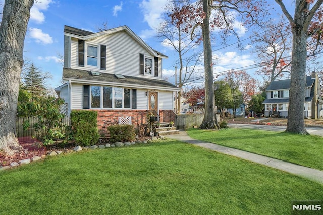 front facade with a front lawn