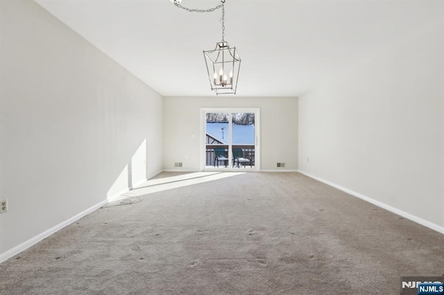 interior space with carpet and a chandelier