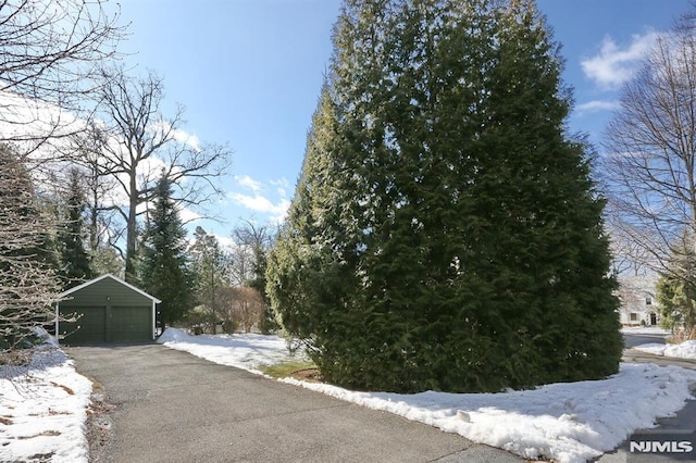 view of street with aphalt driveway