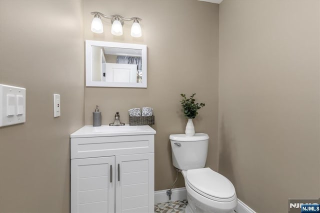 bathroom with vanity and toilet