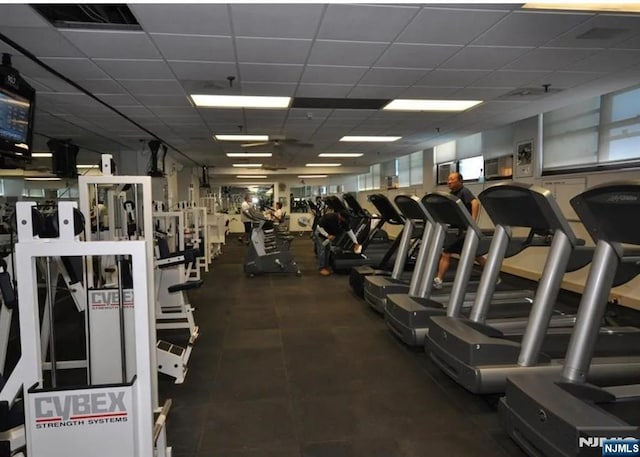 gym featuring a paneled ceiling