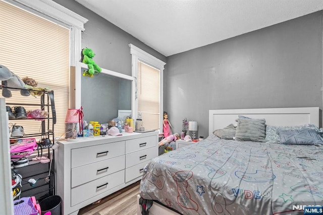 bedroom featuring light wood-type flooring