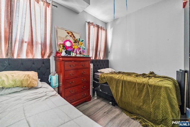 bedroom with hardwood / wood-style flooring