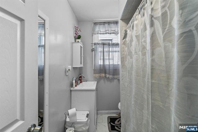 bathroom featuring sink and toilet