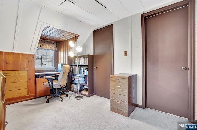 carpeted office with wooden walls