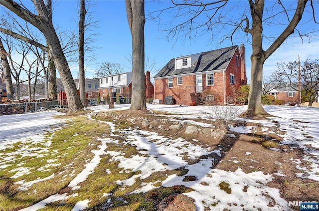 view of yard layered in snow