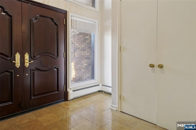 foyer featuring a baseboard radiator