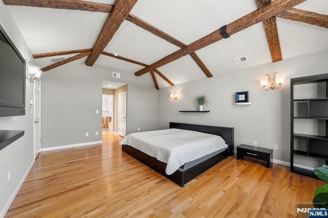 bedroom with vaulted ceiling with beams, a notable chandelier, and light hardwood / wood-style floors