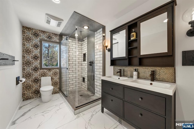 bathroom featuring vanity, decorative backsplash, toilet, and walk in shower