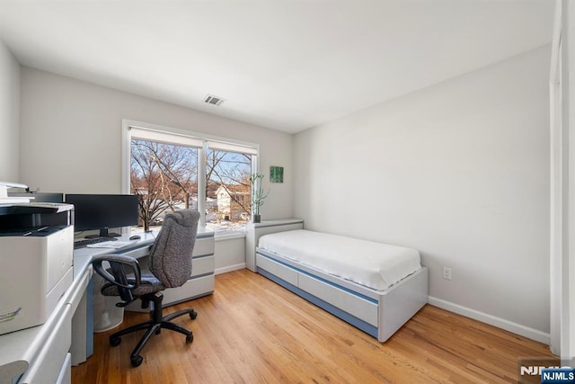 bedroom featuring light hardwood / wood-style floors