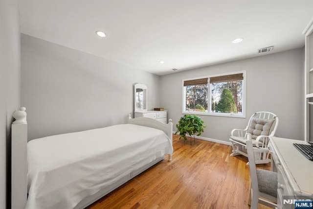 bedroom with light wood-type flooring