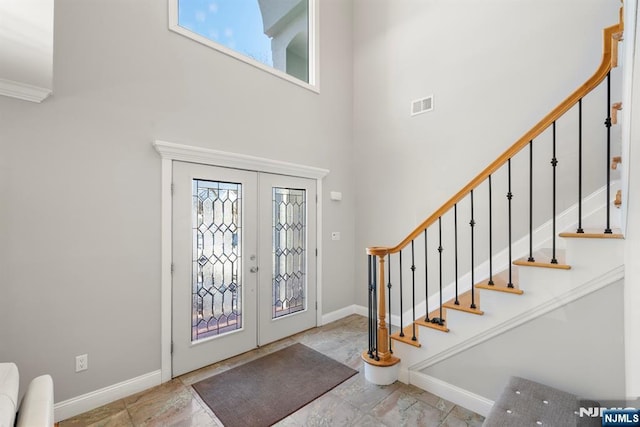 foyer entrance featuring french doors