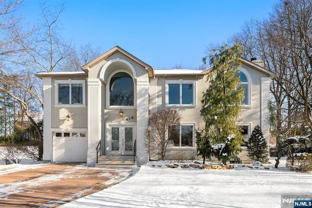 view of front of house with french doors and a garage