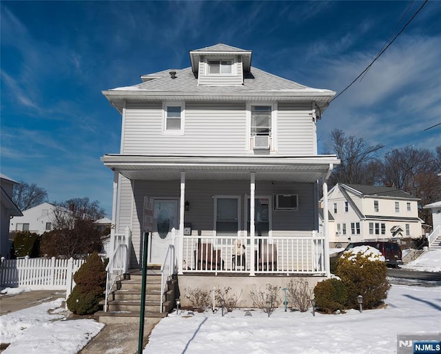 view of property featuring covered porch