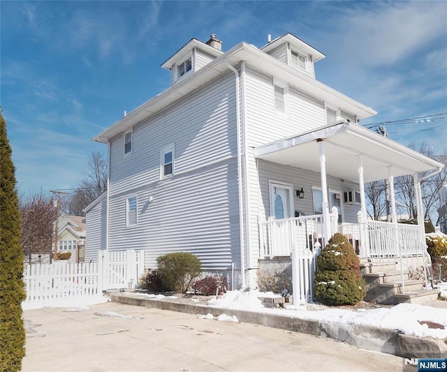 view of property exterior featuring a porch